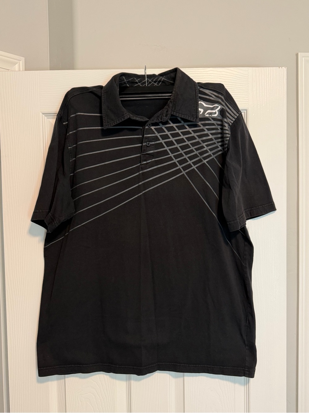 Fox Black Polo with Gray Geometric Stripe Detailing